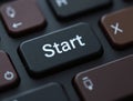 Black keyboard with start button suggesting beginning of new project Royalty Free Stock Photo