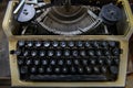 Black keyboard of a vintage typewriter with the Cyrillic alphabet. Close-up of rusty soviet typewriter with Russian letters
