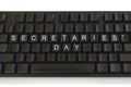 Black keyboard on white background. The inscription on the buttons - Secretaries Day. Minimal concept
