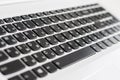 Black keyboard in white laptop close-up with perspective Royalty Free Stock Photo