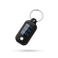 Black keychain with an integrated solar panel and small LED light Royalty Free Stock Photo