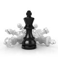 Black king standing over fallen white chess pieces Royalty Free Stock Photo