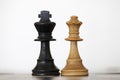 Black king and white queen wooden chess pieces Royalty Free Stock Photo