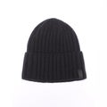 Black knitted men`s hat isolated on white Royalty Free Stock Photo