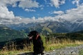 Cute dog in the foreground with amazing panorama of the mount blanc in the background.