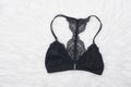 Black lace bra on the white fur. Fashion concept Royalty Free Stock Photo