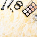 Black lace lingerie with beauty care products, make up cosmetics, jewelry in black and gold. Fashion flat lay, top view Royalty Free Stock Photo