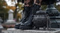 Black Lace-Up Boots and Cauldron Bag in Cemetery Setting Royalty Free Stock Photo