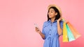 Black Lady Using Phone Carrying Shopper Bags In Studio, Panorama,