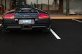 Black Lamborghini Gallardo parked on a street of Vancouver. Sport car Lamborghini outdoor. View of Lamborghini supercar