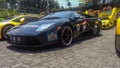 Black Lamborghini Murcielago in a car parking lot Royalty Free Stock Photo