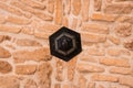 Black Lamp in chirch gallery in the center of orange stone seiling background, symmetry, horizontal, architecture, cyprus, st.