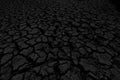 Black land, humus, covered with deep cracks in the dark Royalty Free Stock Photo