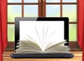 Black laptop and openned book on wooden table over window Royalty Free Stock Photo