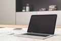 Black laptop screen on blurry light designer desktop Royalty Free Stock Photo