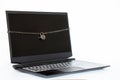 Black laptop tied with chain with a padlock on a white background, security systems for computers