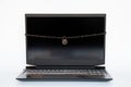 Black laptop tied with chain with a padlock on a white background, security systems for computers