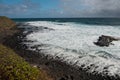 Black Lava Rock Beach in Kauai Royalty Free Stock Photo