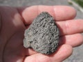 Black Lava Rock In Hand, Small Stone, Geology Photo Royalty Free Stock Photo