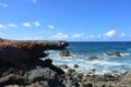 Black Lava Rock with Waves Coming Ashore in Aruba Royalty Free Stock Photo