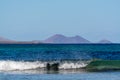 Black lava rocks and water waves of Atlantic ocean, nature landscape on Lanzarote, Canary islands, Spain Royalty Free Stock Photo