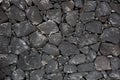 Black lava stone volcanic masonry wall