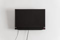 Black LCD or LED tv screen hanging on a wall Royalty Free Stock Photo