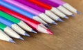 Black lead pencils lie in a row, one pencil has a red core and put forward, small depth of sharpness Royalty Free Stock Photo