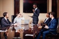 African American business man giving presentation to associates Royalty Free Stock Photo