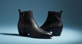Black Leather Ankle Boots on Blue Background Royalty Free Stock Photo