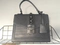 Black leather bag on a