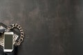 Black leather bag with chain, white phone, zebra print on a black background Royalty Free Stock Photo