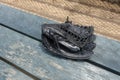 Black leather baseball glove on the bench batters fence casting Royalty Free Stock Photo