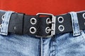 Black leather belt, blue jeans Royalty Free Stock Photo