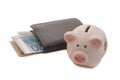 Black Leather Bi-Fold Wallet and a Piggy Bank Royalty Free Stock Photo