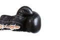 Black leather boxer glove punching from the left isolated on white