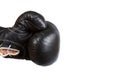 Black leather boxer glove punching from the left isolated on white
