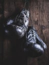 , black leather boxing gloves hanging on a nail Royalty Free Stock Photo