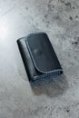Black leather cardholder on a gray Royalty Free Stock Photo