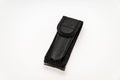 Black leather case for a pocketknife isolated on a white background