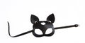 Black leather cat mask on white background. Copy space. Royalty Free Stock Photo