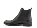 black leather chelsea boots with black elasticated side details, pattern details and black rubber sole. Isolated close