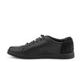 Black leather classic sneakers with laces. Casual men& x27;s style. Black rubber soles.  close-up on white Royalty Free Stock Photo