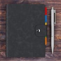 Black Leather Covered Personal Diary or Organiser Book with Pen Royalty Free Stock Photo