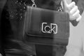 Black leather hand bag by Calvin Klein in a fashion store showroom
