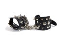 Black leather handcuffs isolated