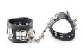 Black leather handcuffs isolated on white