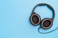 Black Leather Headphone on blue for Music Concept Royalty Free Stock Photo