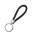 Black leather keychain isolated on white, top view Royalty Free Stock Photo