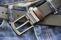 Black leather men`s belt and blue jeans Royalty Free Stock Photo